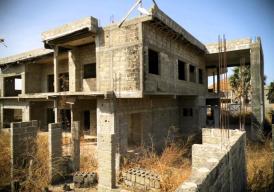 Unfinished eight‑bedroom property in Tujereng Estate